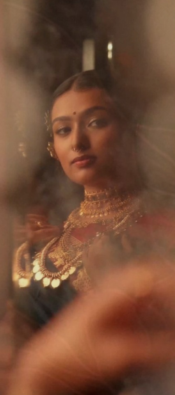 A bride glimpsed through a soft veil, the opening chapter of The Adorn story